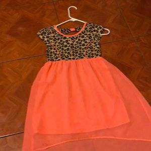 A cheater and orange dress